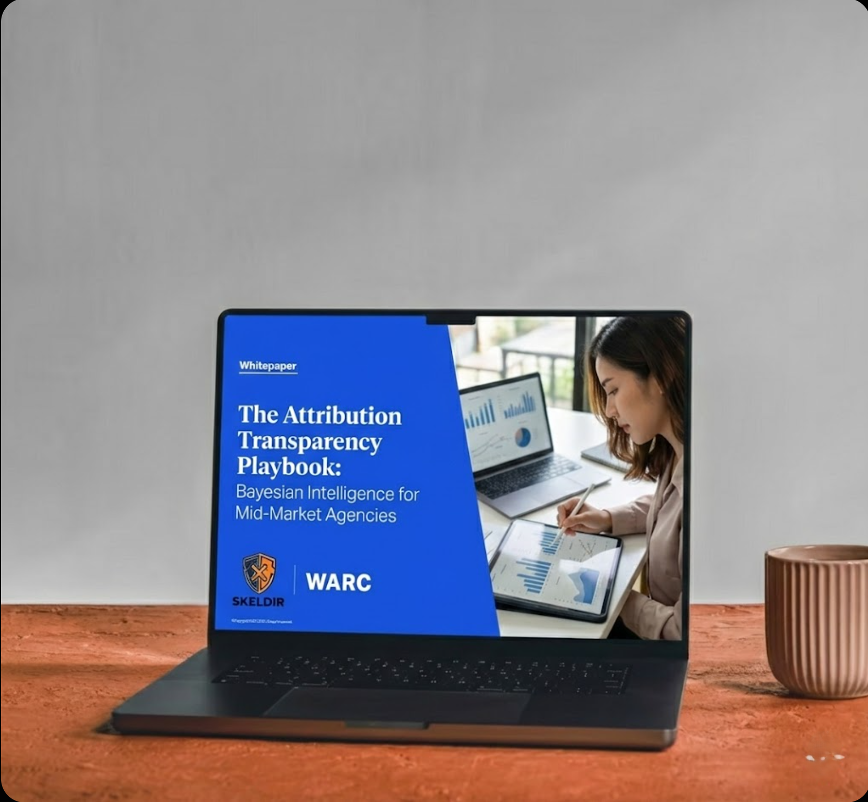 The Attribution Transparency Playbook displayed on a laptop — Bayesian Intelligence for Mid-Market Agencies whitepaper by Skeldir and WARC